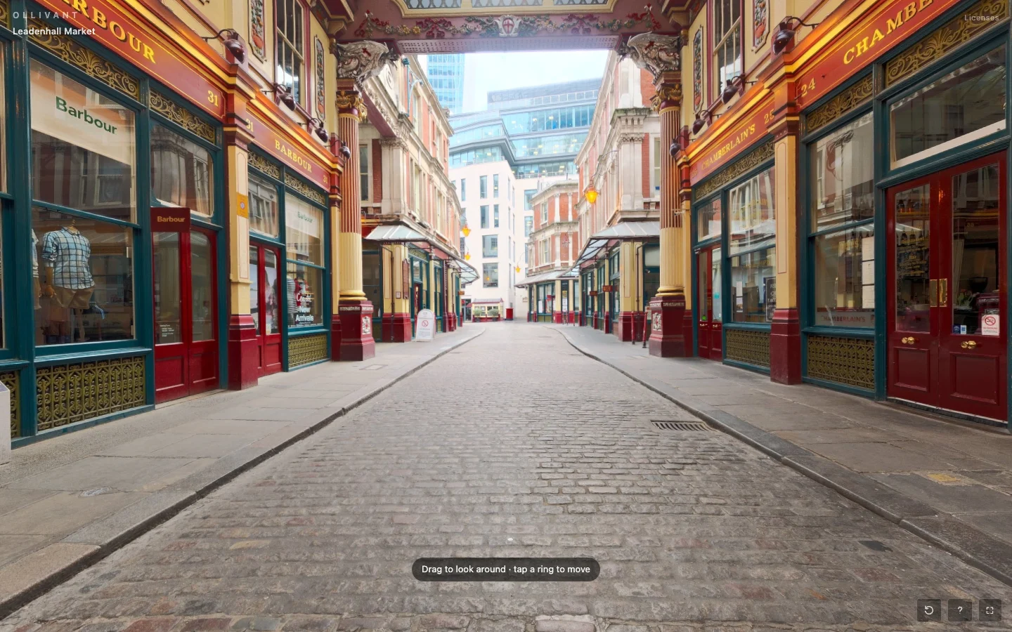 The Ollivant tour viewer in a desktop browser, looking down a covered Victorian market arcade lined with shopfronts.